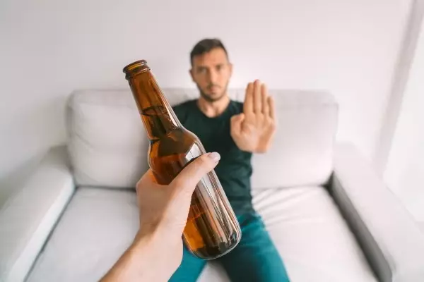 no-alcohol-young-man-refuses-drink-beer-making-stop-gesture-bottle-beer