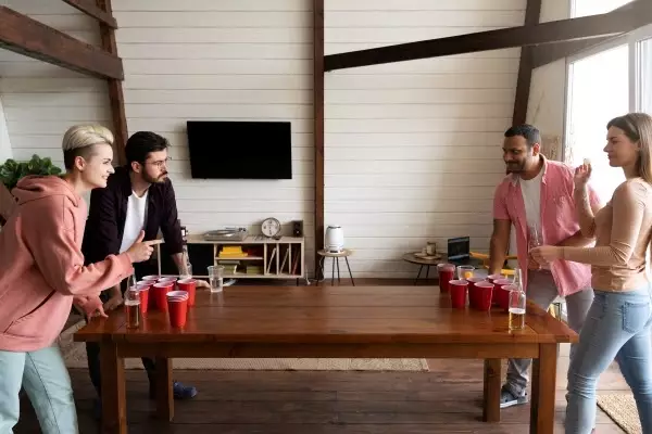 people-playing-beer-pong-indoor-party