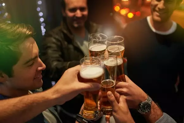 nights-like-these-high-angle-shot-guys-toasting-with-beers-party